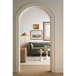 Rowe Madeline 90-inch sofa in sage, supplier lifestyle photograph viewed through an archway